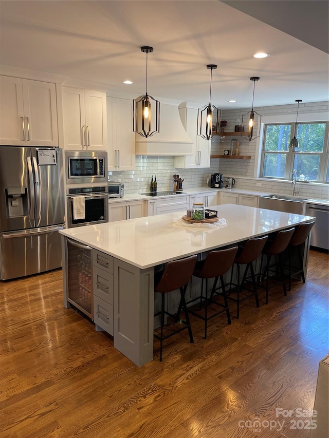 1427 Kinks Ln Unit 47, Maiden, NC 28650 - kitchen featuring stainless steel appliances, a sink, custom range hood, a center island, and recessed lighting