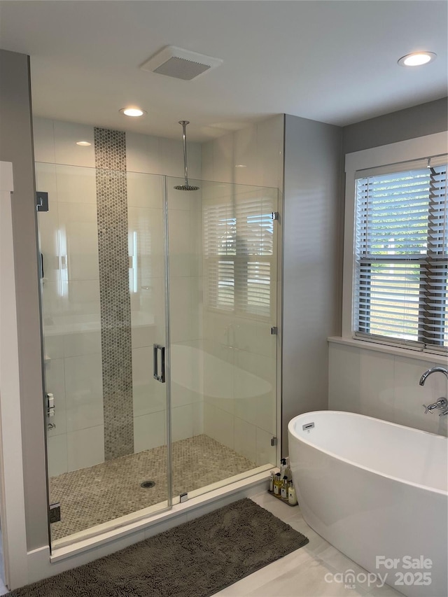 1427 Kinks Ln Unit 47, Maiden, NC 28650 - bathroom featuring a stall shower, a freestanding tub, and recessed lighting