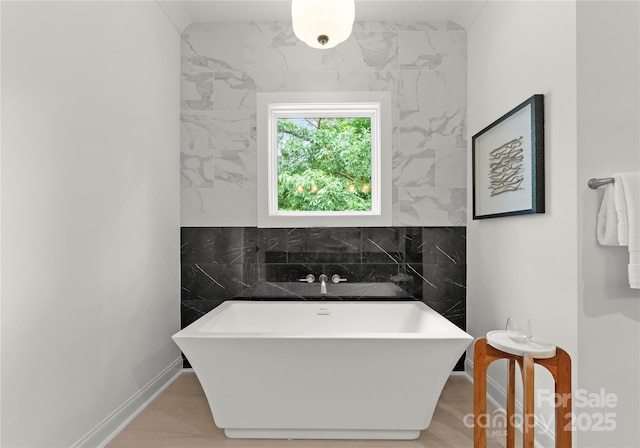 2033 Camp Greene St, Charlotte, NC 28208 - full bath with a freestanding bath and baseboards