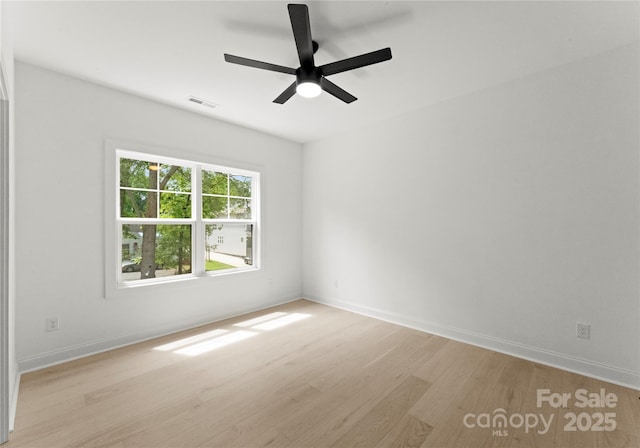 2033 Camp Greene St, Charlotte, NC 28208 - unfurnished room featuring light wood-style floors, baseboards, and ceiling fan