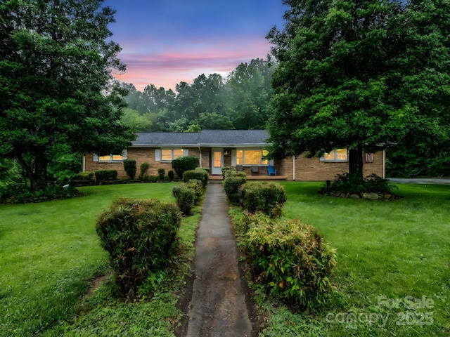 989 Mine Gap Rd, Zirconia, NC 28790 - single story home with brick siding and a lawn