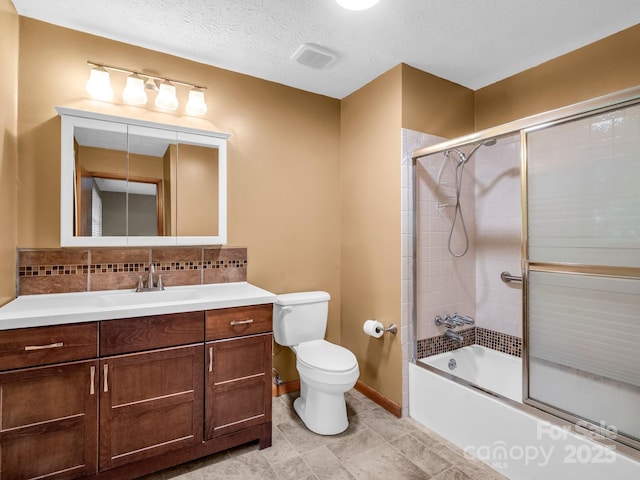 989 Mine Gap Rd, Zirconia, NC 28790 - bathroom featuring toilet, vanity, combined bath / shower with glass door, decorative backsplash, and baseboards