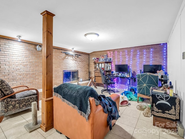 989 Mine Gap Rd, Zirconia, NC 28790 - tiled living room with brick wall and a brick fireplace