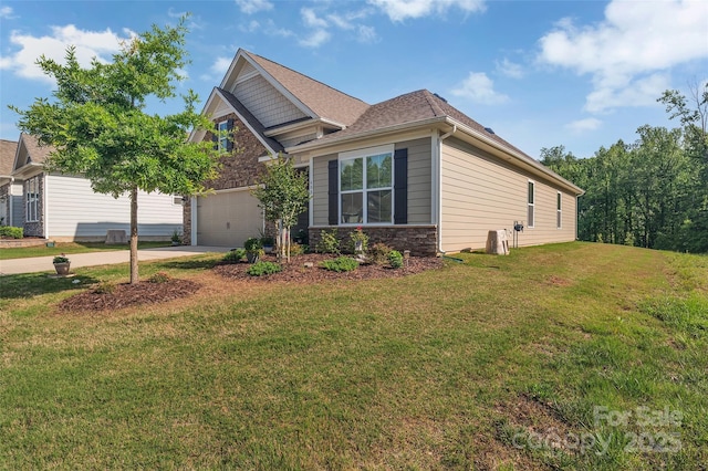 608 Latrobe Dr, Iron Station, NC 28080 - view of front of property featuring concrete driveway, a garage, stone siding, and a front yard