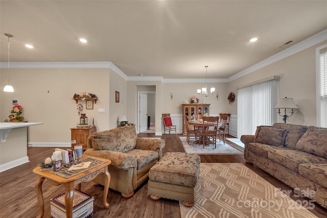 608 Latrobe Dr, Iron Station, NC 28080 - living area featuring wood finished floors, a chandelier, recessed lighting, and crown molding