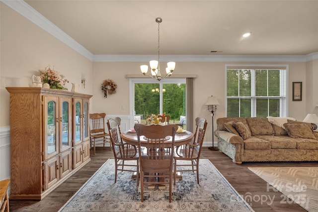 608 Latrobe Dr, Iron Station, NC 28080 - dining space featuring a chandelier, ornamental molding, dark wood finished floors, and a wainscoted wall