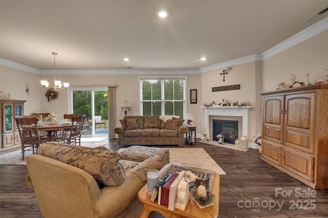 608 Latrobe Dr, Iron Station, NC 28080 - living area with a chandelier, a fireplace with flush hearth, crown molding, dark wood finished floors, and recessed lighting