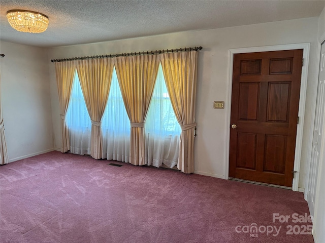 6018 Unionville Rd, Monroe, NC 28110 - carpeted empty room with baseboards and a textured ceiling