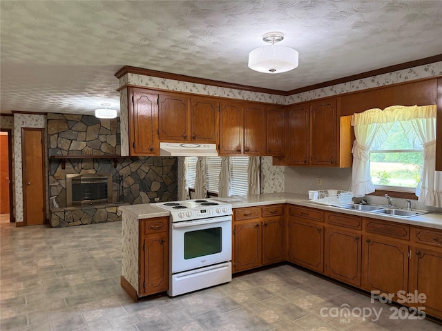 6018 Unionville Rd, Monroe, NC 28110 - kitchen featuring white range with electric stovetop, a sink, brown cabinets, under cabinet range hood, and wallpapered walls