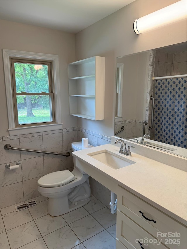 6018 Unionville Rd, Monroe, NC 28110 - full bathroom with tile walls, toilet, a sink, marble finish flooring, and a shower