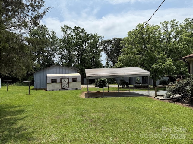 6018 Unionville Rd, Monroe, NC 28110 - view of green lawn with a carport and an outdoor structure