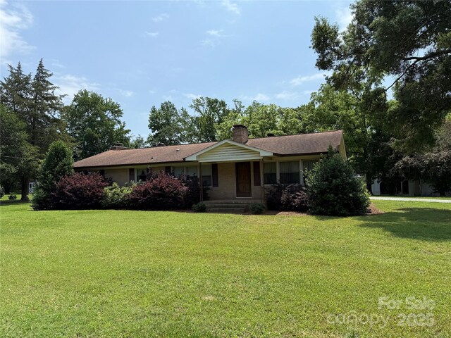 6018 Unionville Rd, Monroe, NC 28110 - ranch-style home featuring a chimney and a front lawn