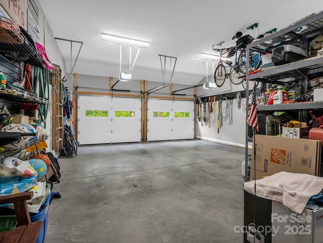 26 Balsam High Rd, Candler, NC 28715 - garage with a garage door opener and baseboards