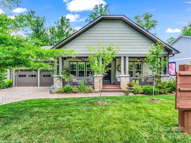 26 Balsam High Rd, Biltmore Lake, NC 28715 - craftsman inspired home featuring ceiling fan, a porch, a front yard, driveway, and a garage