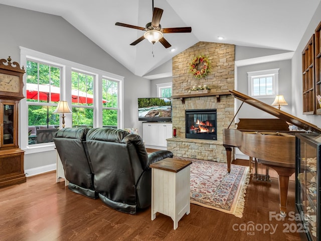 26 Balsam High Rd, Biltmore Lake, NC 28715 - living area with vaulted ceiling, a ceiling fan, a stone fireplace, healthy amount of natural light, and wood finished floors