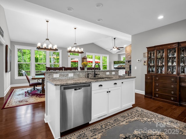 26 Balsam High Rd, Biltmore Lake, NC 28715 - kitchen featuring stainless steel dishwasher, a chandelier, vaulted ceiling, dark wood-type flooring, and a large fireplace