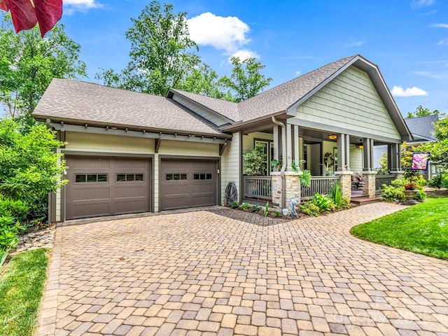 26 Balsam High Rd, Biltmore Lake, NC 28715 - craftsman-style home featuring covered porch, decorative driveway, an attached garage, and a shingled roof