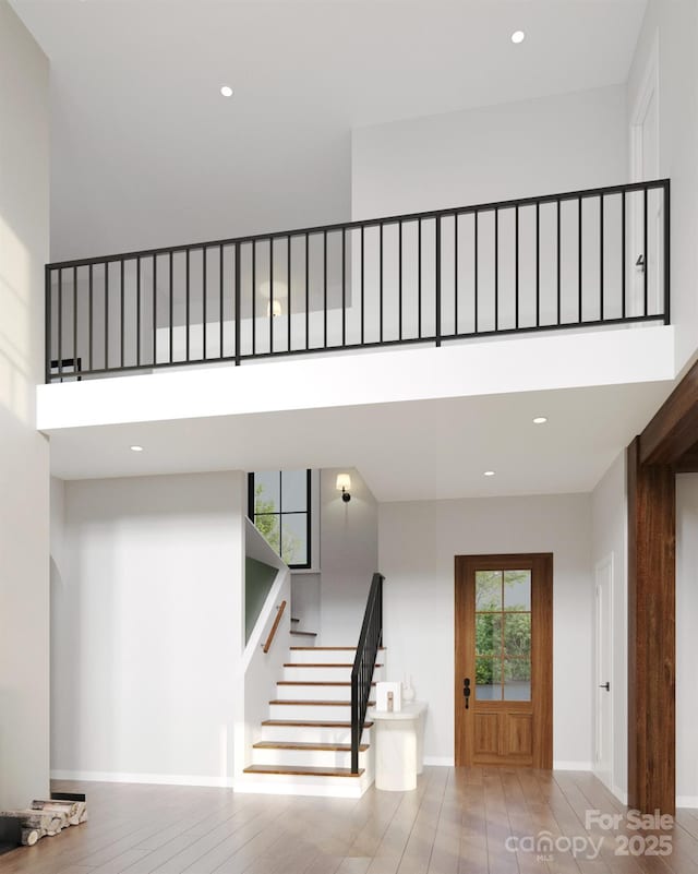20000 Schooner Dr, Cornelius, NC 28031 - stairway featuring a high ceiling, recessed lighting, and wood finished floors