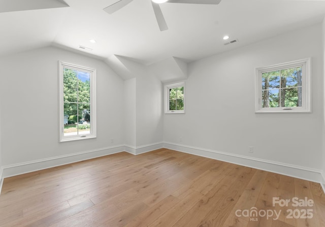 20000 Schooner Dr, Cornelius, NC 28031 - additional living space featuring plenty of natural light, baseboards, lofted ceiling, ceiling fan, and light wood-type flooring