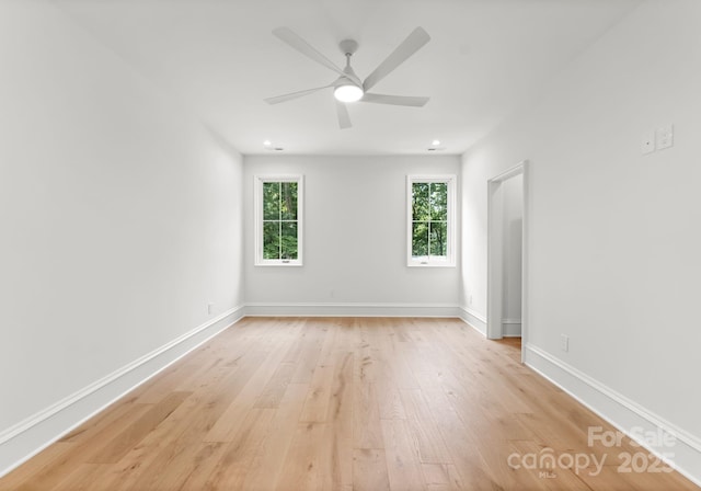 20000 Schooner Dr, Cornelius, NC 28031 - empty room with light wood-type flooring, healthy amount of natural light, ceiling fan, and baseboards