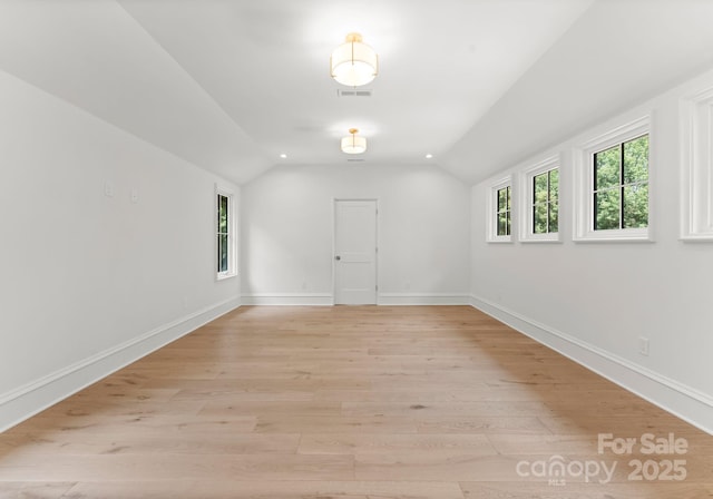 20000 Schooner Dr, Cornelius, NC 28031 - spare room featuring vaulted ceiling, light wood-style floors, and baseboards