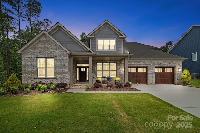 9833 Ardley Park Way, Mint Hill, NC 28227 - craftsman-style home with a garage, concrete driveway, brick siding, a porch, and a yard