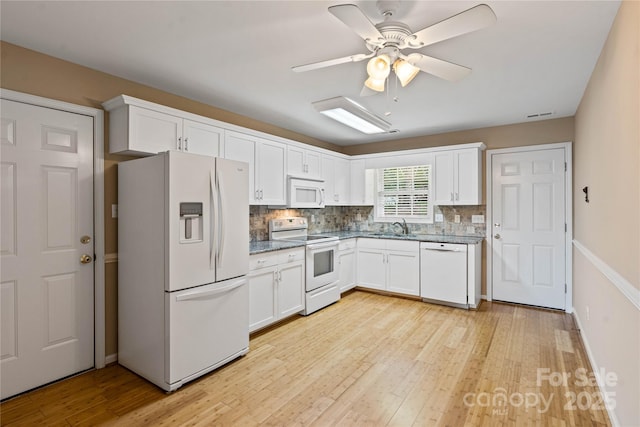 2561 26th Ave NE, Hickory, NC 28601 - kitchen featuring white appliances, a sink, light wood-style flooring, and white cabinets