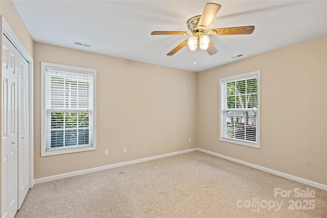 2561 26th Ave NE, Hickory, NC 28601 - unfurnished bedroom featuring carpet flooring, baseboards, a closet, and ceiling fan