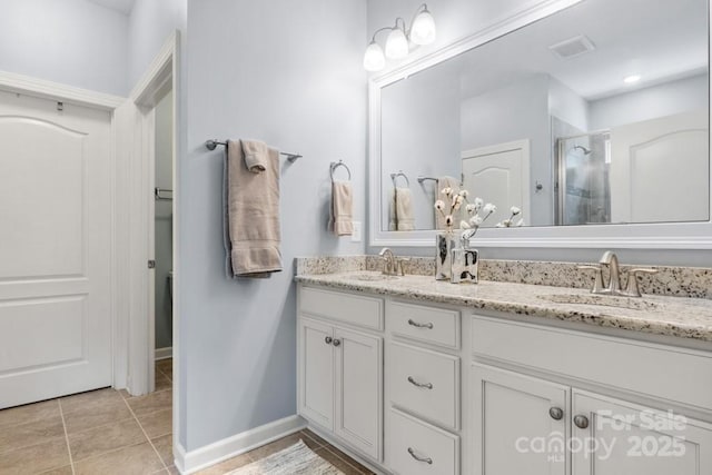 1467 Tranquility Blvd, Lancaster, SC 29720 - full bathroom featuring double vanity, a stall shower, tile patterned floors, and baseboards