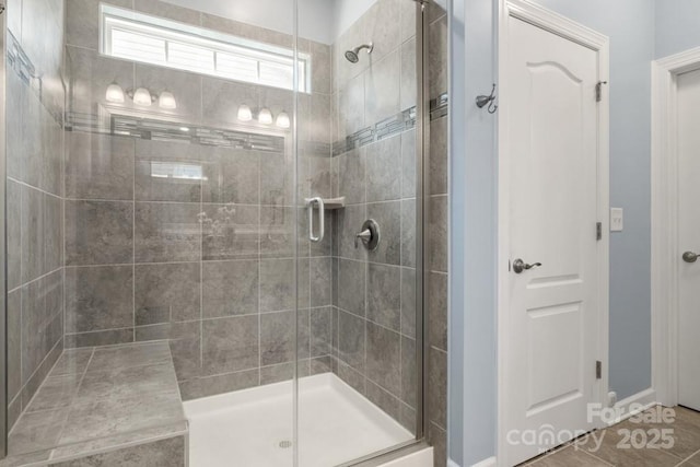 1467 Tranquility Blvd, Lancaster, SC 29720 - bathroom featuring a stall shower, baseboards, and tile patterned flooring