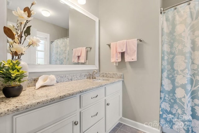 1467 Tranquility Blvd, Lancaster, SC 29720 - bathroom featuring vanity, tile patterned flooring, baseboards, and curtained shower