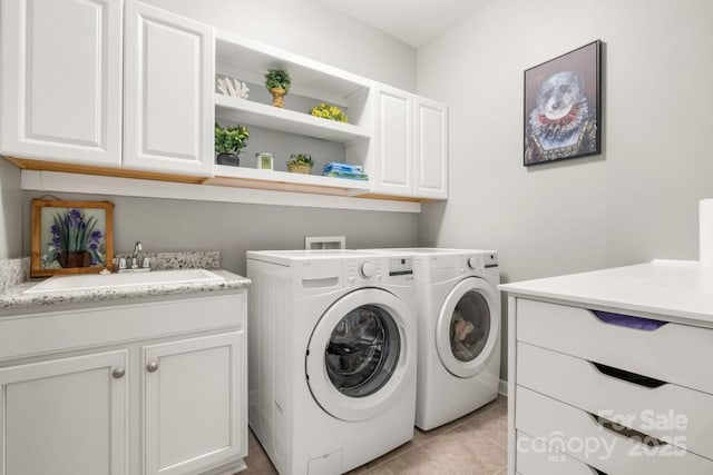 1467 Tranquility Blvd, Lancaster, SC 29720 - laundry room with cabinet space, washer and dryer, and light tile patterned floors