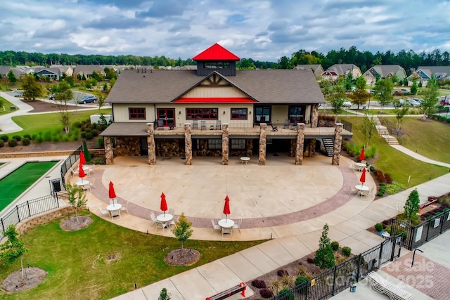 1467 Tranquility Blvd, Lancaster, SC 29720 - back of property with stone siding, a residential view, and stairway