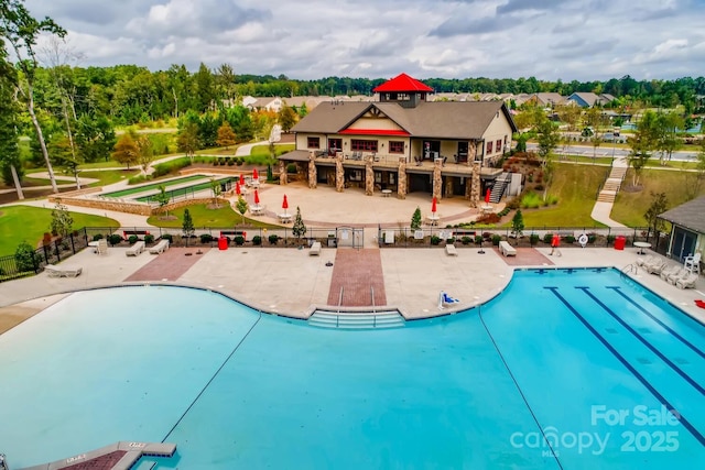 1467 Tranquility Blvd, Lancaster, SC 29720 - community pool featuring a patio