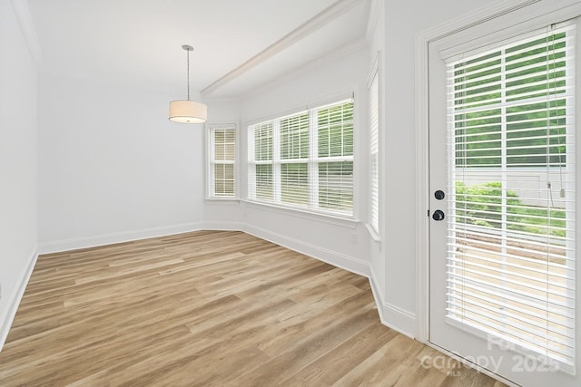 1009 Jerry Ln, Matthews, NC 28105 - unfurnished dining area featuring crown molding, baseboards, and light wood-style flooring