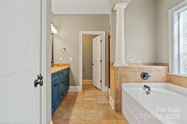 1009 Jerry Ln, Matthews, NC 28105 - full bathroom with vanity, decorative columns, and a bath