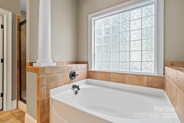 1009 Jerry Ln, Matthews, NC 28105 - bathroom featuring healthy amount of natural light, a garden tub, and a stall shower