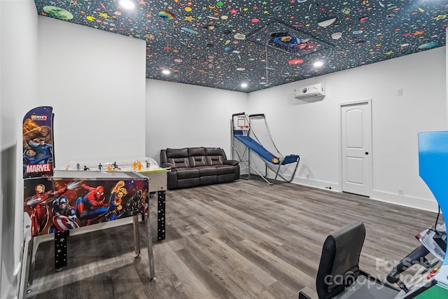 1009 Jerry Ln, Matthews, NC 28105 - playroom with a wall unit AC, wood finished floors, and baseboards