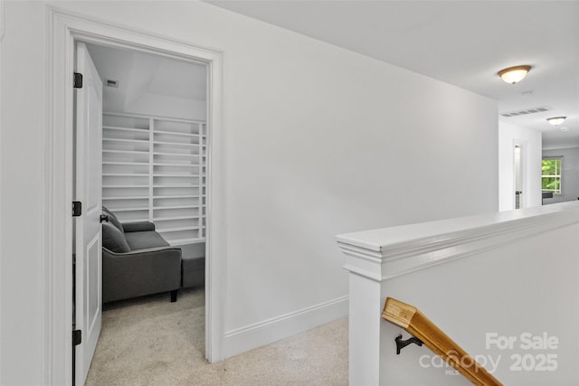 1009 Jerry Ln, Matthews, NC 28105 - corridor with an upstairs landing, carpet flooring, and baseboards