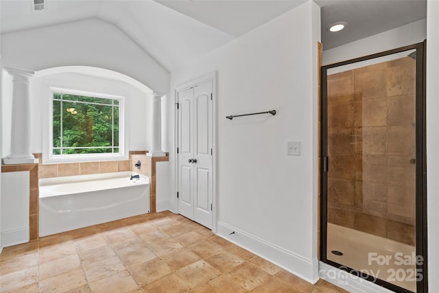 1009 Jerry Ln, Matthews, NC 28105 - full bath featuring ornate columns, a garden tub, a shower stall, and vaulted ceiling