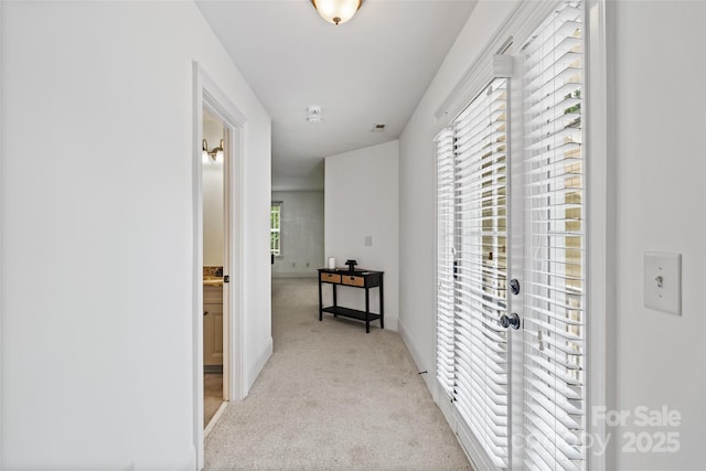 1009 Jerry Ln, Matthews, NC 28105 - corridor featuring light colored carpet and baseboards