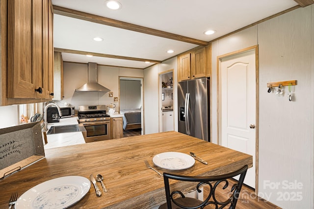 410 Fork Mountain Rd, Bakersville, NC 28705 - kitchen with appliances with stainless steel finishes, wall chimney range hood, a sink, dark wood-style flooring, and recessed lighting