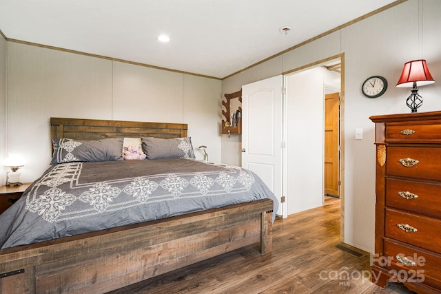 410 Fork Mountain Rd, Bakersville, NC 28705 - bedroom featuring crown molding, wood finished floors, and recessed lighting
