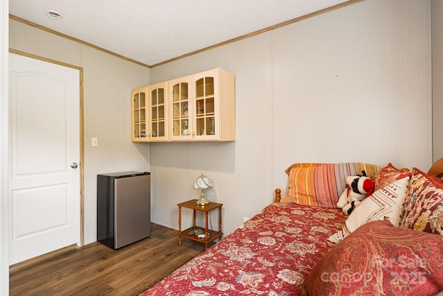 410 Fork Mountain Rd, Bakersville, NC 28705 - bedroom featuring ornamental molding, freestanding refrigerator, and dark wood-style floors