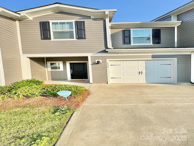 1510 Old Rivers Rd Unit 171, Concord, NC 28027 - view of front facade featuring a garage, driveway, and a porch