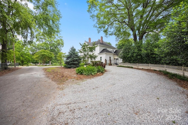 530 E Rutledge Ave, Gaffney, SC 29340 - view of front of property featuring gravel driveway and a chimney