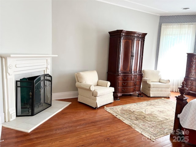530 E Rutledge Ave, Gaffney, SC 29340 - living area with ornamental molding, wood finished floors, and a fireplace
