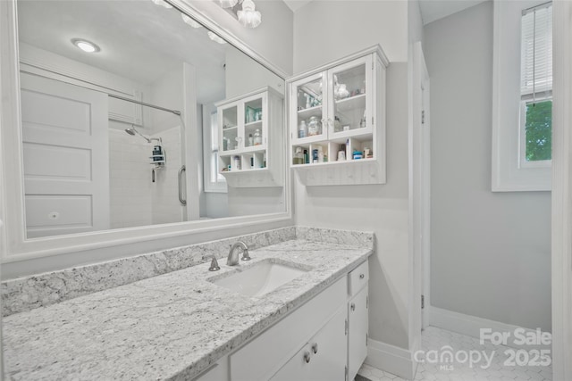 530 E Rutledge Ave, Gaffney, SC 29340 - bathroom featuring vanity, tiled shower, and tile patterned flooring