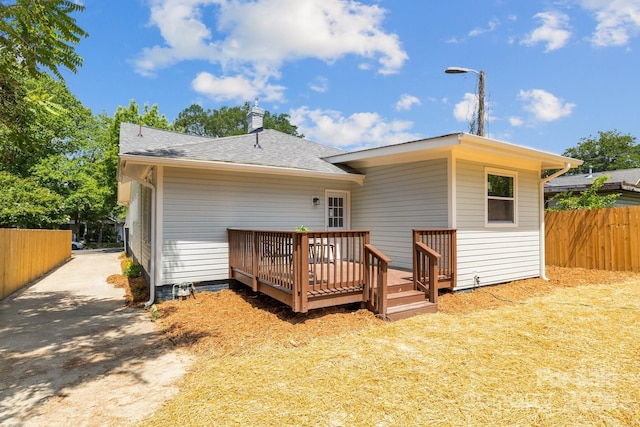 1922 Thomas Ave, Charlotte, NC 28205 - back of house with a wooden deck, a chimney, and a shingled roof