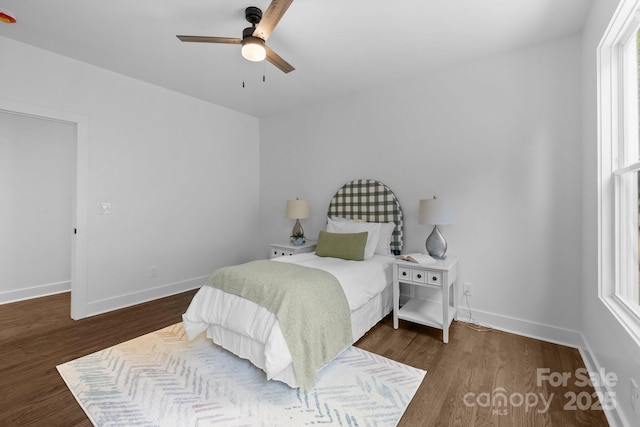1922 Thomas Ave, Charlotte, NC 28205 - bedroom with dark wood-style floors and a ceiling fan